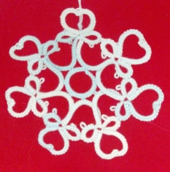Sweetheart Snowflake pattern variation by Natalie Rogers. Original pattern is Gina Butler's garter. This snowflake variation is shared with permission from Gina.