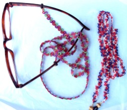 Challenge Accepted - Reader Submission for Weekly Challenge #40 - Patti's Lanyard. Stephanie decided to use her lanyards as eye glass chains. She used Perfect Quilter #17-wt (color: volcano) for the pair attached to the glasses and Sulky #12-wt cotton 'Blendables' in a red/white/blue mix for Mom's. Red seed beads, size 11, on both.